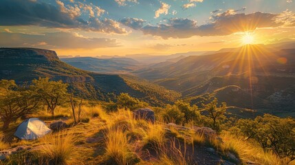 Wall Mural - A scenic campsite on a hilltop overlooking a sprawling valley bathed in the golden light of the setting sun.
