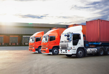 Wall Mural - Semi Trailer Trucks on The Parking Lot at Warehouse with The Sunset. Distribution Warehouse Center. Truck Container Shipping. Freight Truck Logistics Cargo Transport.