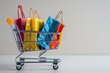 © Boomanoid - Colorful shopping bags in shopping cart