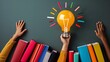 © HendraGalus - Glowing light bulb surrounded by books and diverse hands reaching out symbolizing empowerment through education