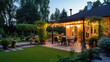 © Fang - Summer evening on the patio of beautiful suburban house with lights in the garden garden,, generative ai