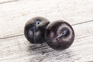 Two ripe sweet black plums