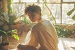© SkoldPanda - Young Man in Cozy Room with Plants and Sunlight