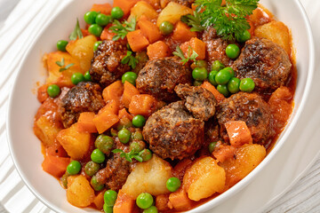 Sticker - turkish meatball stew, sulu kofte, in a bowl