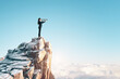 © Who is Danny - A person standing on a high cliff peak using binoculars, with a clear blue sky and cloud background, concept of vision and exploration. Generative AI
