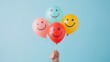 © 69 - Colorful smiley face balloons held by a woman's hand against a light blue background, evoking happiness and optimism in a cheerful and playful atmosphere