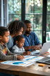 © Mariia - Family Collaborating on School Project with Laptops and Charts, Parents and Children Learning Together in a Modern Home Environment, Emphasizing Education, Teamwork, and Family Bonding, Lifestyle Imag