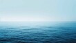 © Maximilian - The image features a tranquil ocean with gentle waves under a serene blue sky, offering a peaceful view of the distant horizon with a sense of infinite calmness.