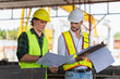 © Poguz.P - Site manager and worker at construction site, Engineer man and foreman team inspect the construction site