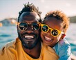 © VISUAL BACKGROUND - Father and son smiling on the boat.