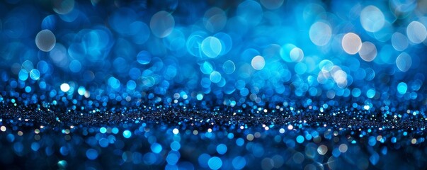 Blue glitter abstract background with bokeh lights, festive and sparkling concept