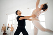 © peopleimages.com - Ballet, couple or people in class for training, lesson or learning by teacher in studio or art school. Teamwork, help or ballerina dancing in practice routine for theater performance with instructor