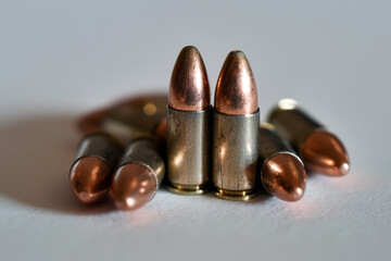 9mm pistol bullets and a close view on the light background
