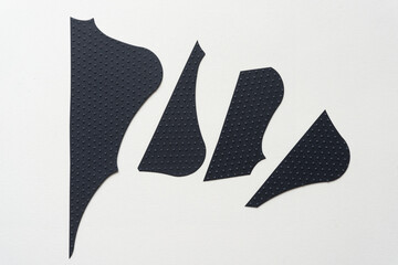 Canvas Print - set of cut black paper shapes on blank paper