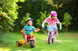 © famveldman - Two children riding bikes