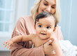 © KayJoint/peopleimages.com - Love, happy and mother with baby in home for parent support, wellness and care for child growth. Family, mama and infant girl with smile for bonding together, healthy development and trust in house