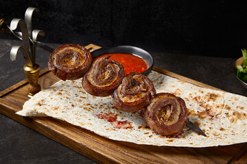 Wall Mural - Skewered Beef and Fat Tail Lamb Roll Kebabs with Flatbread and Red Sauce