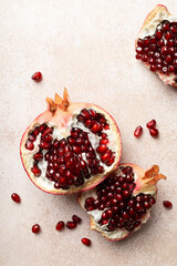 Canvas Print - Pomegranate. Fresh organic juicy pomegranate fruit pieces. Pomegranate seeds, grains, top view.