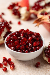 Wall Mural - Pomegranate. Fresh organic juicy pomegranate fruit pieces. Pomegranate seeds, grains.