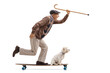 © Ljupco Smokovski - Full length profile shot of a senior man with a dog riding a longboard