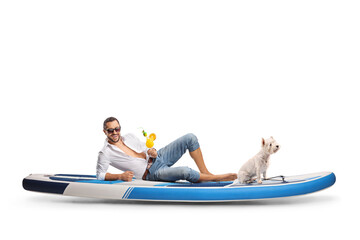 Sticker - Man in jeans with a dog sitting on a SUP and holding a cocktail