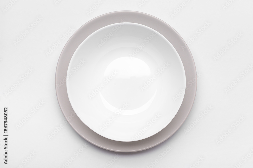 Clean white plates on white background