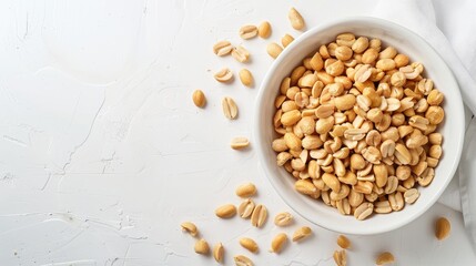 Salted peanuts on white background with space for text