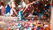 © Lakkhana - DIY craft table with scattered confetti pieces being used for a decoration project