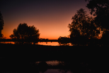 Wall Mural - Sunset over a wetland lake