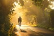 © Amni - Silhouette of a Cyclist on a Country Road at Sunset
