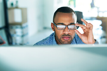 Fototapete - Black man, thinking and computer in office with glasses, research or reading for startup company. Businessman, idea or tech for networking with review, problem solving or brainstorming in workplace