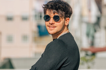 Sticker - portrait of young male with sunglasses in the street