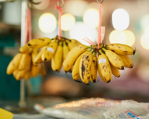 Banana, market and sale with outdoor stall of street vendor for grocery, retail or small business. Food, fruit or green grocer with organic store selling sustainable produce for diet or health