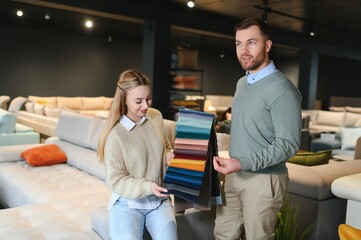 Wall Mural - Married couple in the shop choosing furniture