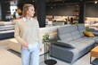 © Serhii - young woman shopping for furniture, sofa and home decor in store