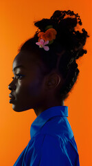 Wall Mural - black woman profile with her hair tied in a bun with a small flower horn