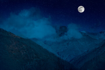 Wall Mural - mountain road through the forest on a full moon night. scenic night landscape of country road at nig
