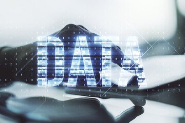 Wall Mural - creative data word sign and finger clicks on a digital tablet on background. multiexposure