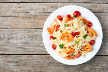 Canvas Print - Italian pasta with shrimps , parmesan and tomatoes