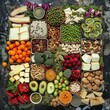 © Aziz - Plant-based whole food diet raw ingredients including fruit, vegetables, grains, legumes, tofu and nuts