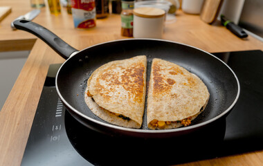 Poster - Chef at the kitchen preparing quesadillas with tofu and sweet corn