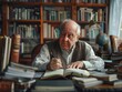 © Vitalii Shkurko - An elderly man writing at a desk in his home library, surrounded by books and scholarly materials.