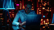 © IntelliPixelForge - Late night scene in private office with male businessman working on laptop smiling at camera data protection engineering network for cyber security