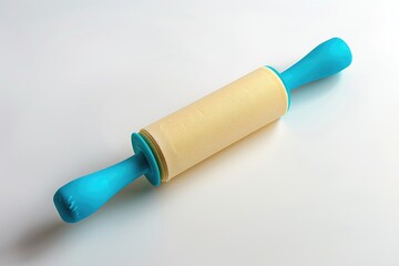 Wall Mural - A rolling pin with a blue handle placed on a white surface, suitable for baking and cooking scenes