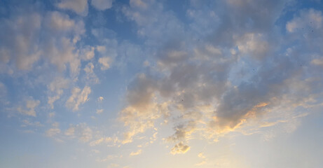 Wall Mural - blue sky clouds background. beautiful weather landscape with cloud and orange sun light on horizon
