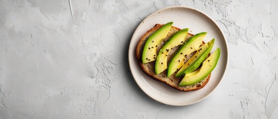 Wall Mural - A plate of avocado toast sits on a white countertop