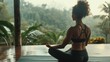 © AlfaSmart - A woman is practicing meditation and mindfulness on a yoga mat in a serene environment