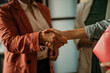 © La Famiglia - Handshake gesturing people connection deal concept. Successful making deal with female business partners