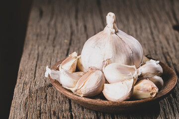 Garlic on a rustic wood background