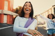 © Jacob Lund - Happy young women enjoying a day out together in the city streets